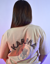 Beige oversized t shirt with bold “Karma” text and symbolic circular graphic – streetwear fashion graphic tee for men and women.