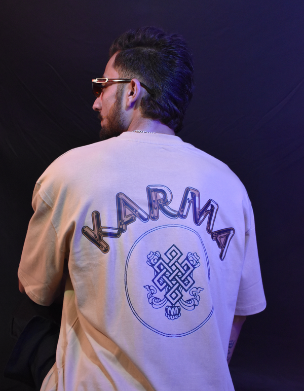 Beige oversized t shirt with bold “Karma” text and symbolic circular graphic – streetwear fashion graphic tee for men and women.