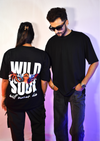 Black oversized t shirt with tiger eyes graphic and bold text “Wild Soul will never die” – streetwear fashion graphic tee for men and women.